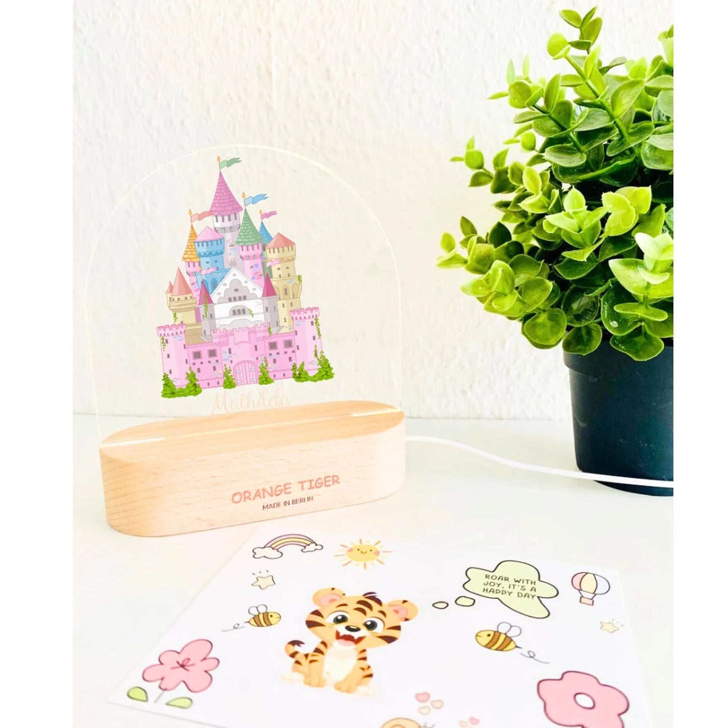 Beautiful Fairy castle night light with colourful towers and flags.