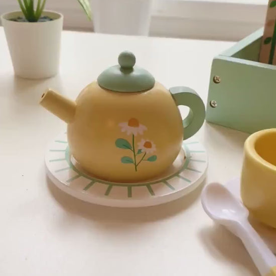 wooden yellow tea set with lots for desserts for pretend play.