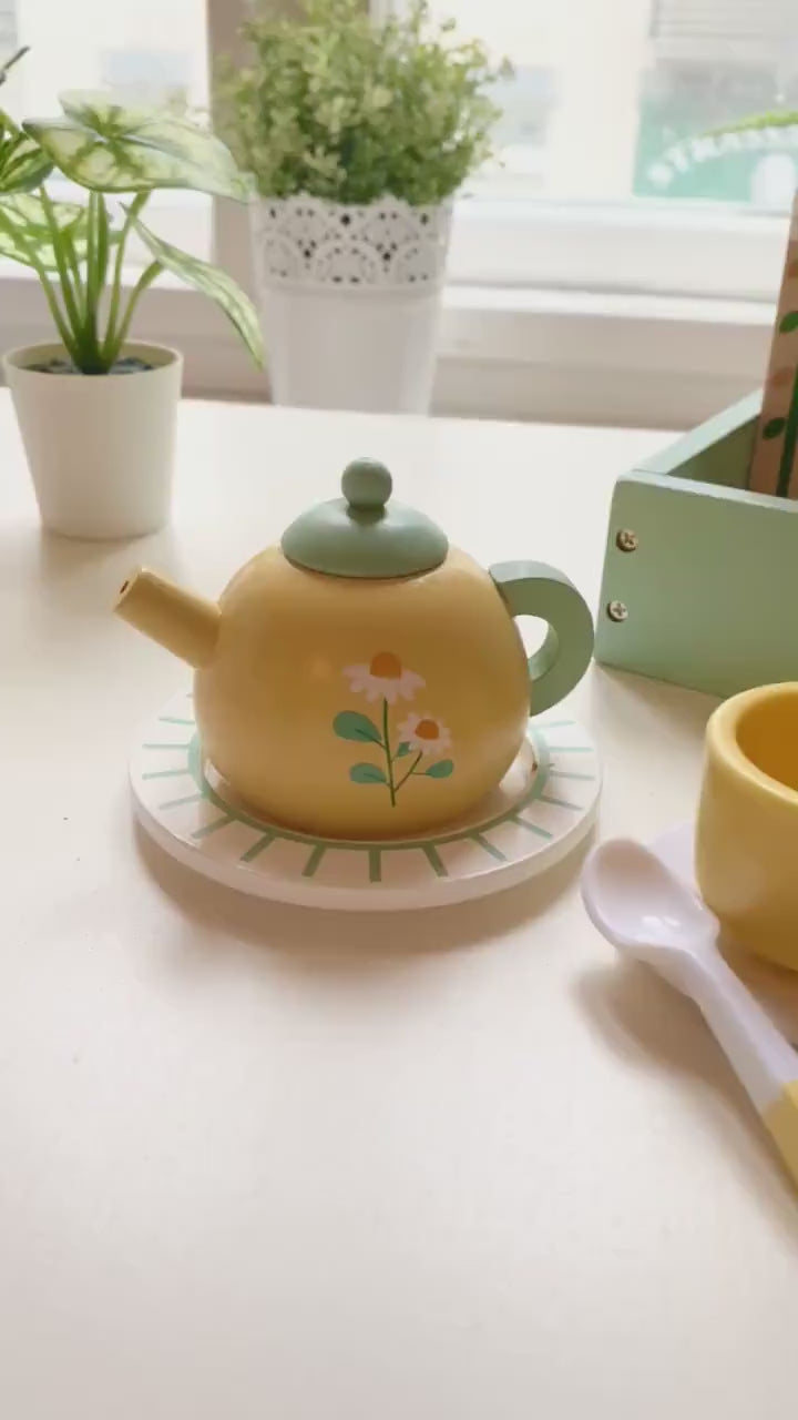 wooden yellow tea set with lots for desserts for pretend play.